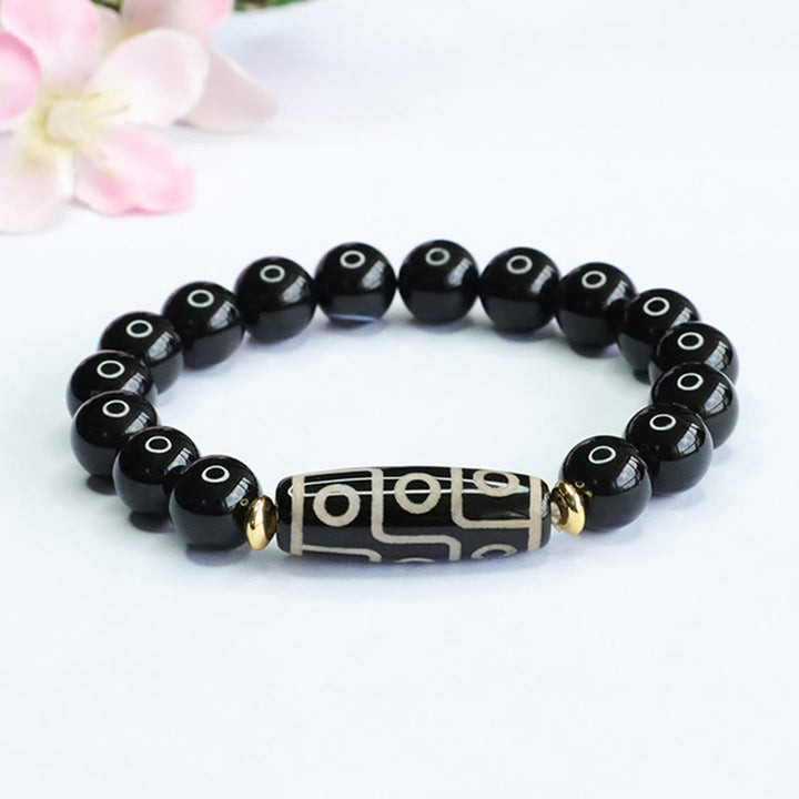 Pulsera de poder de ónix negro con cuentas Dzi tibetanas de nueve ojos de Buddha Stones