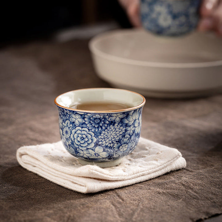 Tazas de té de cerámica de crisantemo con flor de ciruelo y peonía de loto Vintage con Buddha Stones