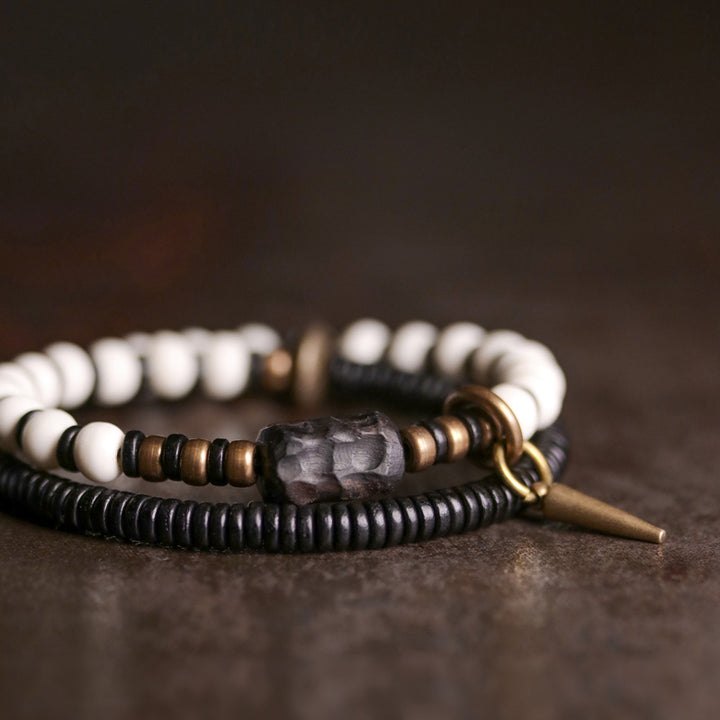 Pulsera de pareja con Buddha Stones, cuentas de hueso, madera de ébano y cobre.