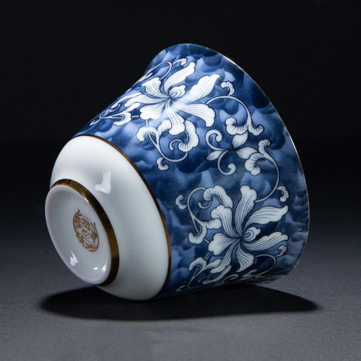 Taza de té de cerámica de porcelana azul y blanca, Buddha Stones, flores coloridas, orquídeas, olas del mar, taza de té de Kung Fu
