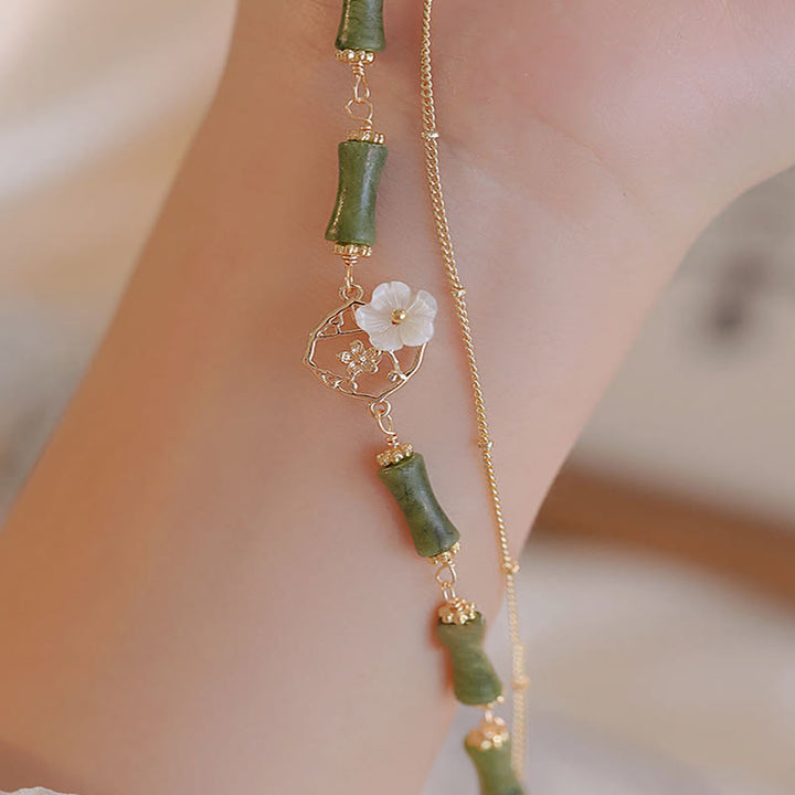 Pulsera de doble capa de cobre chapado en oro de 14 quilates con Buddha Stones , peridoto, flor de bambú y riqueza