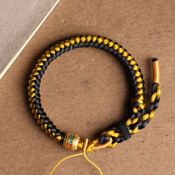 Pulsera de pureza Om Mani Padme Hum de cuerda de dragón de oro negro tibetano hecha a mano con Buddha Stones