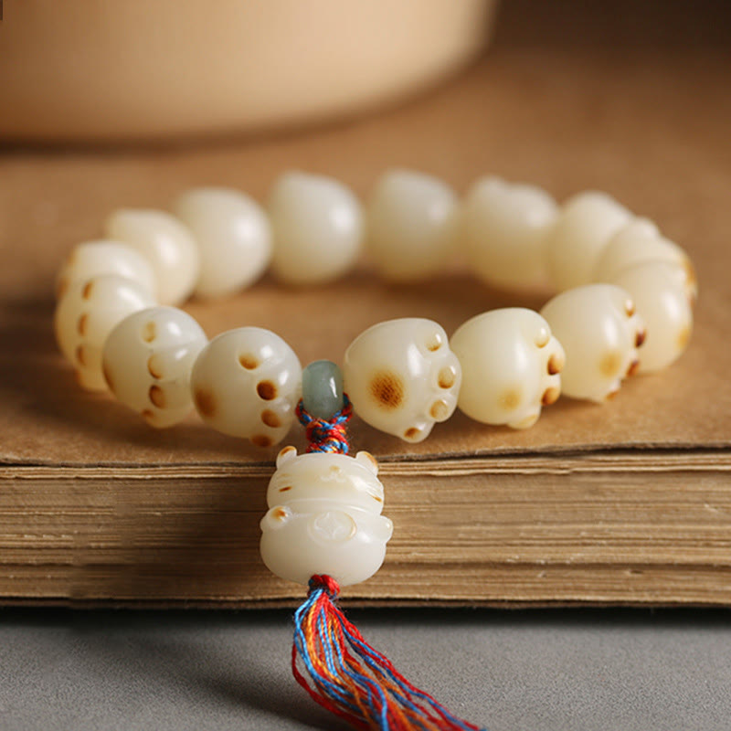 Pulsera de armonía con diseño de pata de gato y semilla de Bodhi de gato de la suerte con Buddha Stones - Borla colorida con forma de pata de gato y semilla de Bodhi - image 1