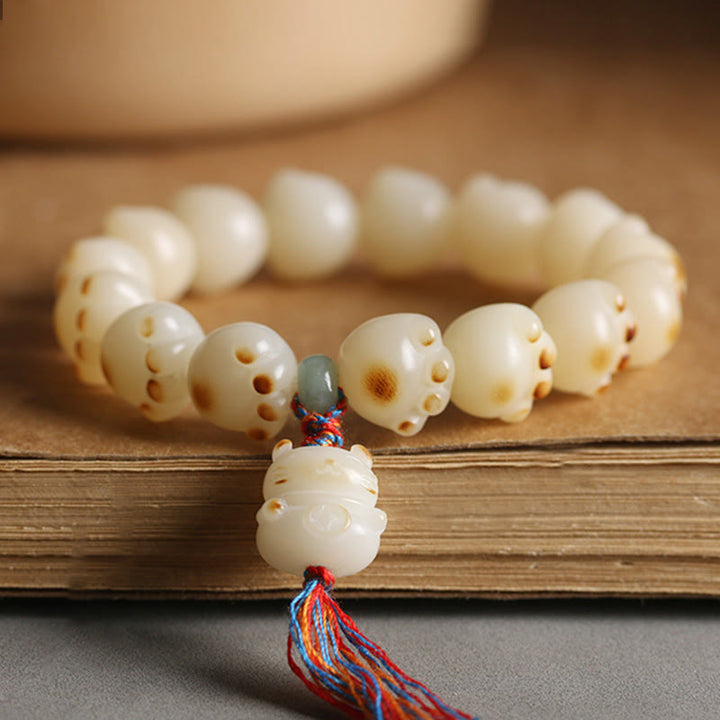 Pulsera de armonía con diseño de pata de gato y semilla de Bodhi de gato de la suerte con Buddha Stones - Borla colorida con forma de pata de gato y semilla de Bodhi - image 1