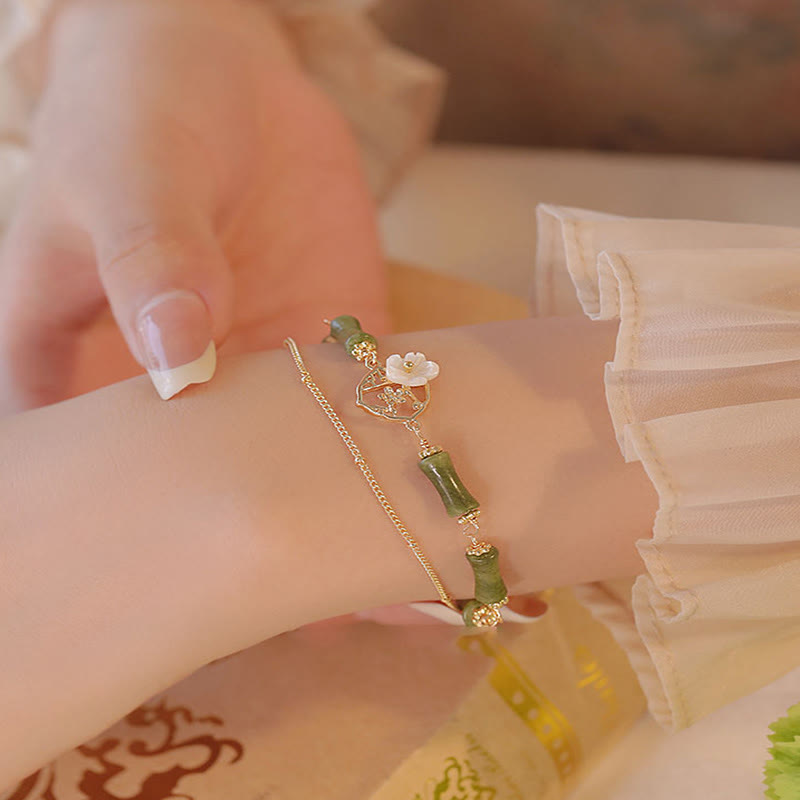Pulsera de doble capa de cobre chapado en oro de 14 quilates con Buddha Stones , peridoto, flor de bambú y riqueza