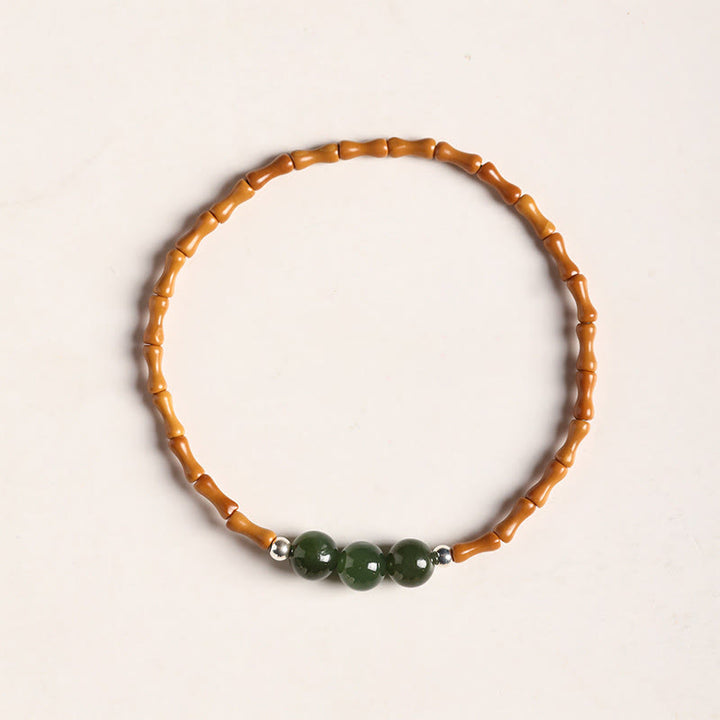Pulsera de la suerte con cuentas de jade hetiano con patrón de bambú de oliva natural con Buddha Stones