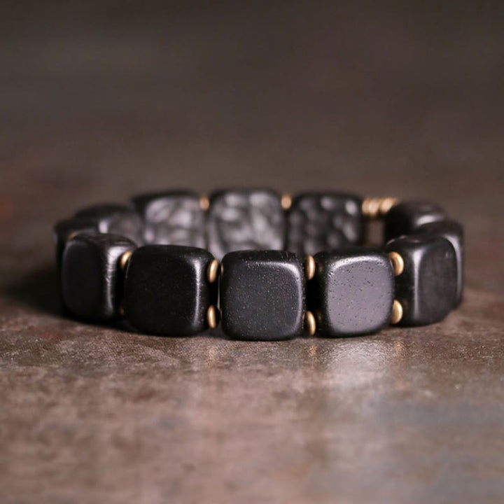 Pulsera de equilibrio de paz de cobre estilo textura de madera de ébano retro con Buddha Stones