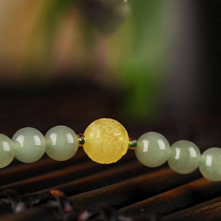 Pulsera de prosperidad de Buda sonriente de ámbar y ágata roja de jade