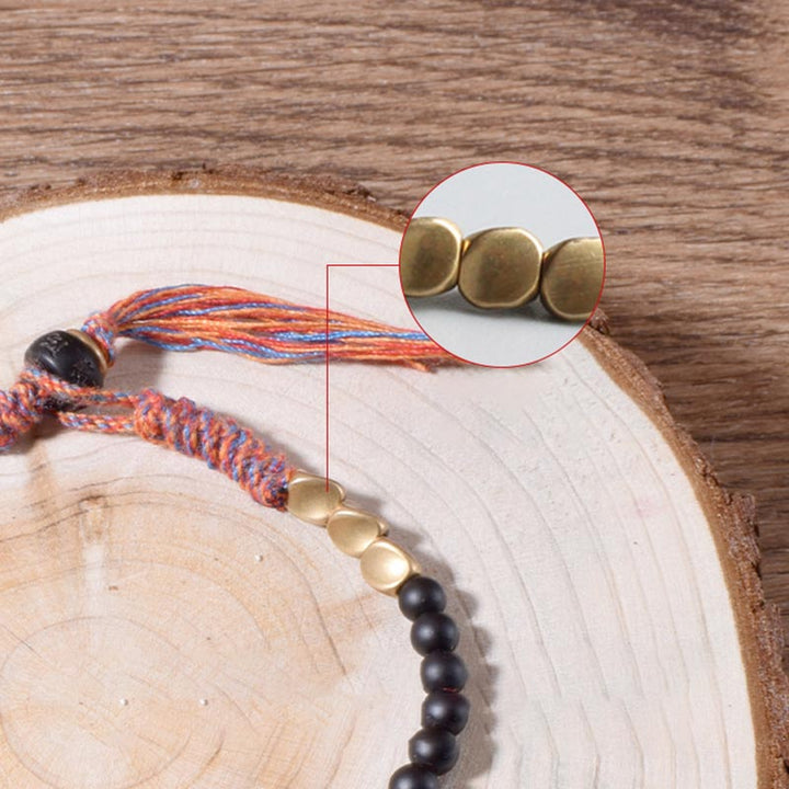 Pulsera con borlas de ónix negro tibetano hecha a mano con Buddha Stones