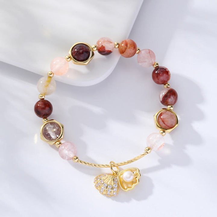 Pulsera de cuentas de protección de concha de cuarzo rutilado de colores naturales con Buddha Stones