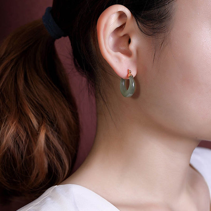 Pendientes colgantes de suerte de prosperidad de jade cian redondo de Buddha Stones