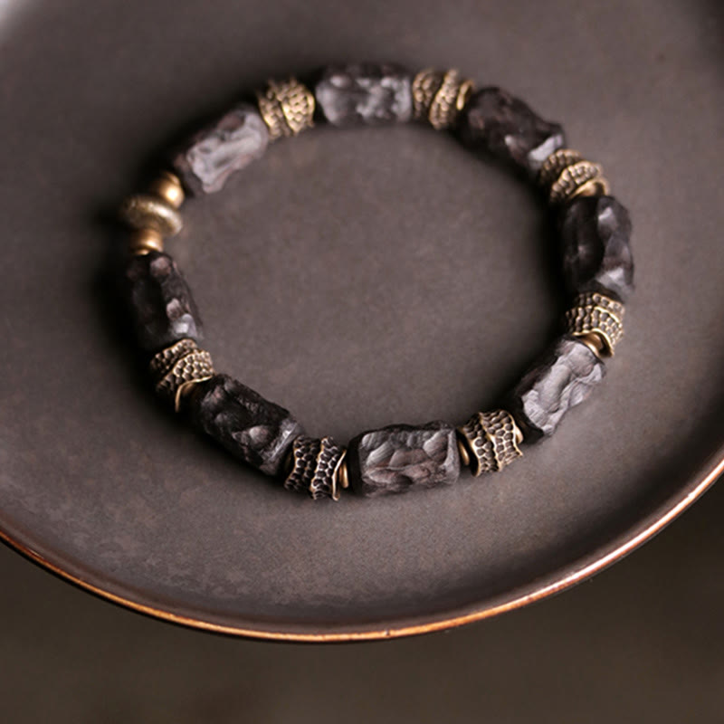 Pulsera de paz tranquila de cobre y madera de ébano tibetano con Buddha Stones