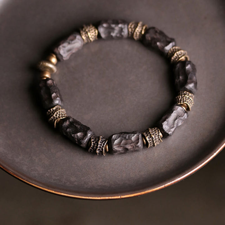 Pulsera de paz tranquila de cobre y madera de ébano tibetano con Buddha Stones