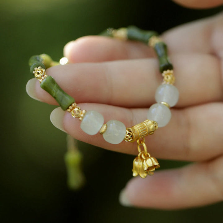 Pulsera de riqueza con Buddha Stones, bambú verde, jade, lirio de los valles