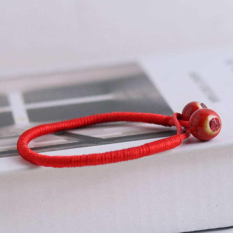 Pulsera de cerámica con hilo rojo de la suerte FengShui de Buddha Stones