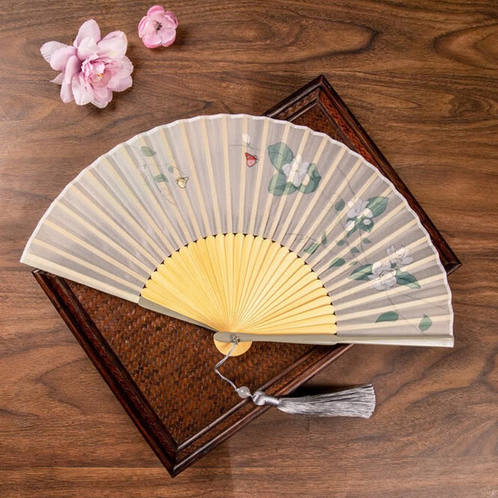 Abanico plegable de bambú de mano con flores de loto jazmín y Buddha Stones