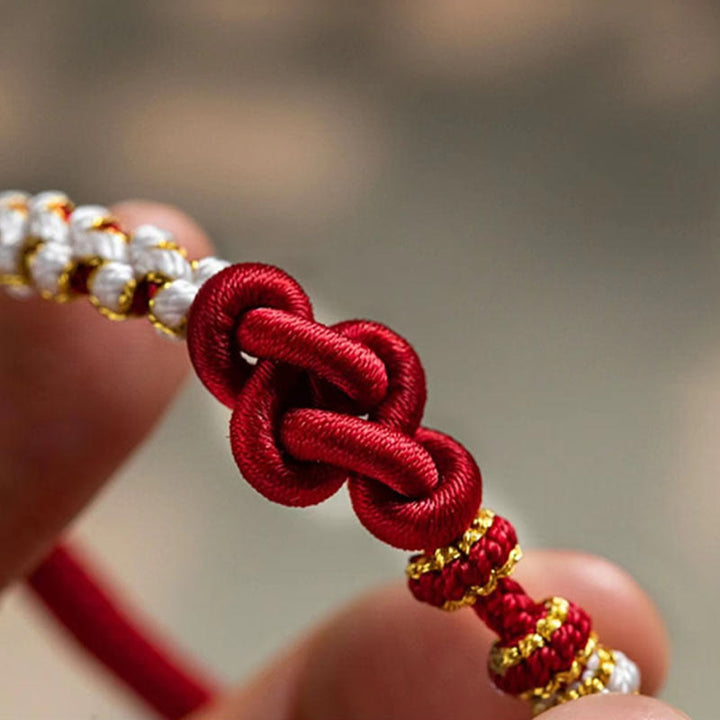 Pulsera de cuerda de la suerte con dije de flor de melocotón, nudo de amor verdadero hecho a mano con Buddha Stones