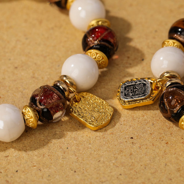 Buddha Stones tibetano Zakiram diosa de la riqueza encanto Liuli vidrio incienso ceniza porcelana pulsera de protección de cuentas