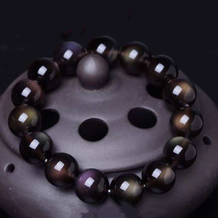 Pulsera positiva de obsidiana arcoíris natural con Buddha Stones
