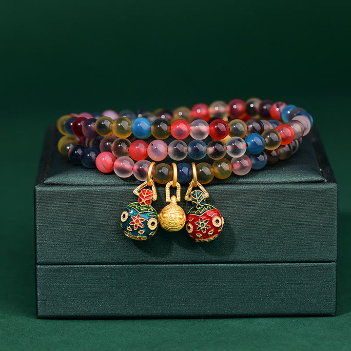 Pulsera de triple envoltura con dije de fuerza familiar de bestia tragadora de oro con ágata de caramelo colorida y Buddha Stones