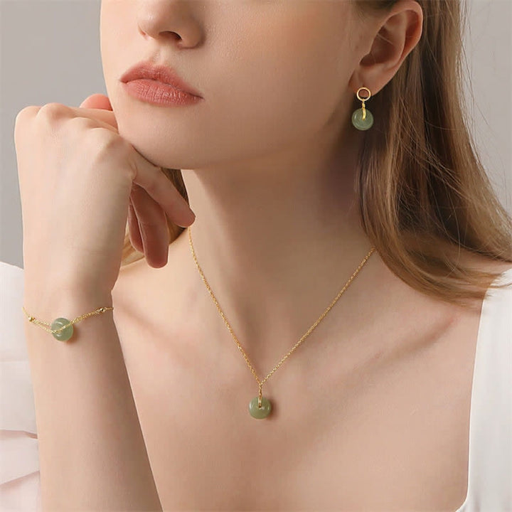 Pendientes colgantes de suerte con hebilla de paz de jade redondo