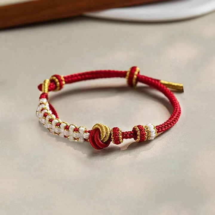 Pulsera de cuerda de la suerte con dije de flor de melocotón, nudo de amor verdadero hecho a mano con Buddha Stones