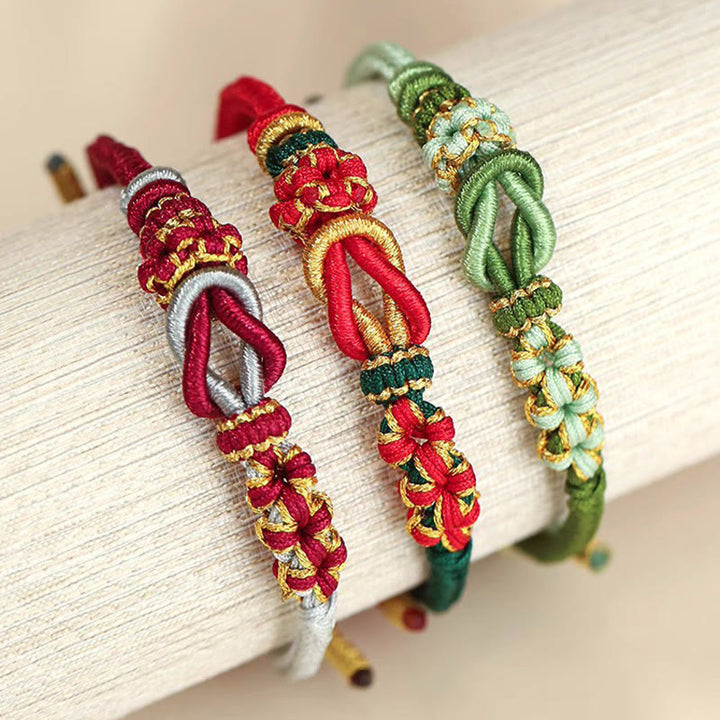 Pulsera de protección de la suerte con nudo de paz de ocho hilos con nudo de flor de melocotón hecho a mano con Buddha Stones