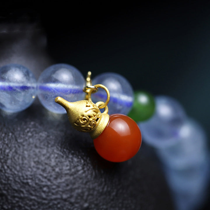 Pulsera con dije de calabaza de la paz con ágata roja y aguamarina