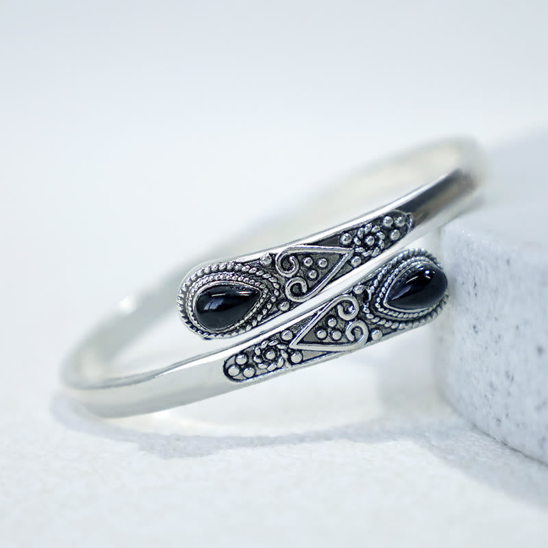 Brazalete de pulsera curativo con patrón de gota de agua de circonita con Buddha Stones