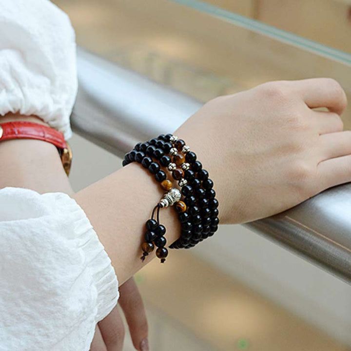 Pulsera Mala con bendición de ojo de tigre de obsidiana negra con Buddha Stones