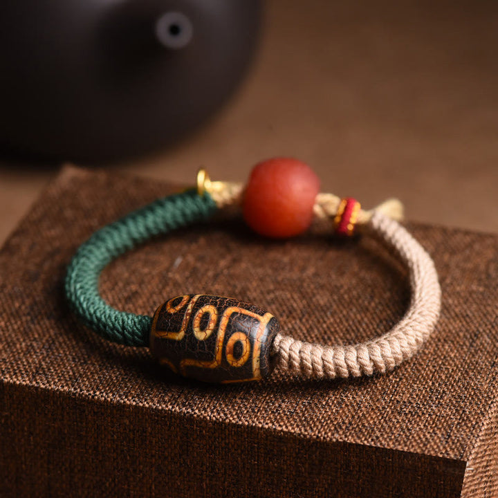 Pulsera de cuerda de riqueza con cuentas Dzi tibetanas de nueve ojos hechas a mano con Buddha Stones