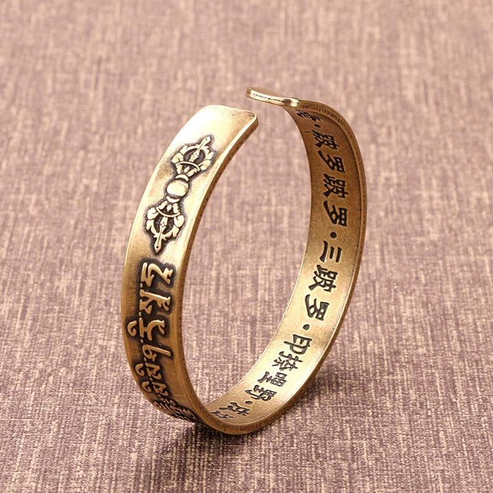 Buddha Stones Pulsera de curación de latón y cobre con mantra tibetano Mahāpratisarā en sánscrito