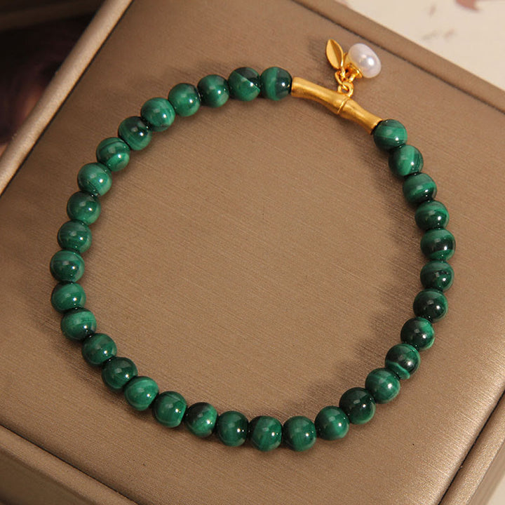 Pulsera antiansiedad de bambú de la suerte con perlas de malaquita natural de Buddha Stones