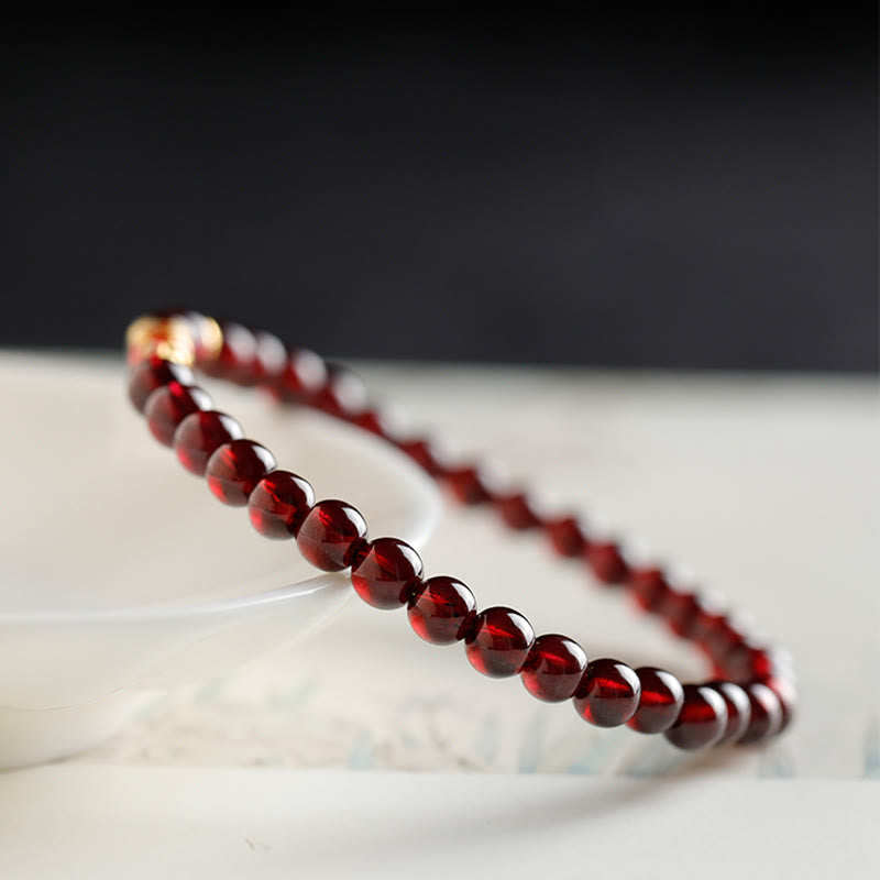 Pulsera de protección con granate natural y pez Koi de oro 999 de Buddha Stones - image 4