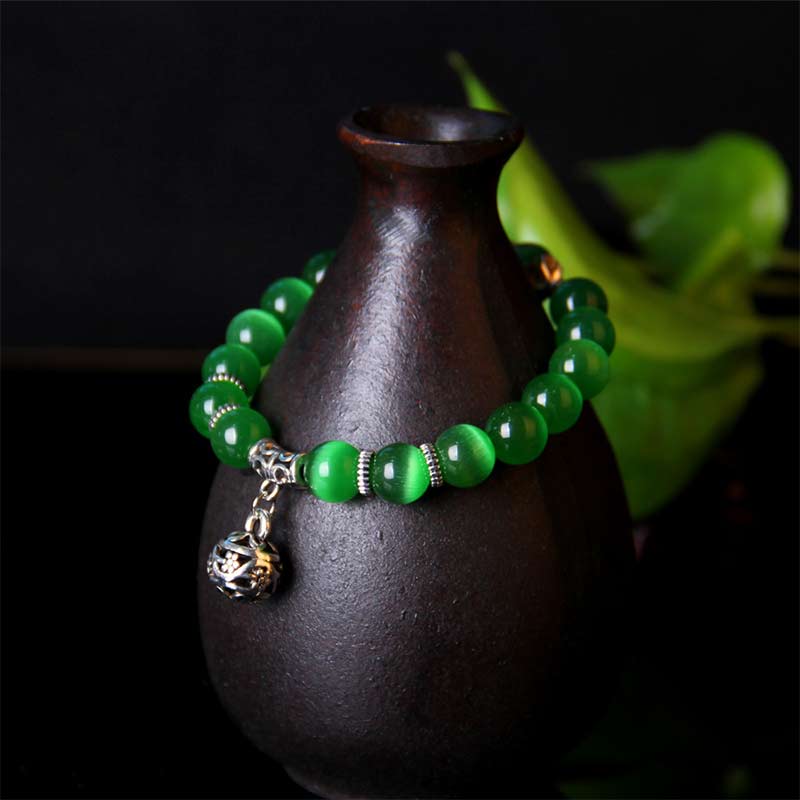 Pulsera de la suerte con ojo de gato tibetano y Buddha Stones