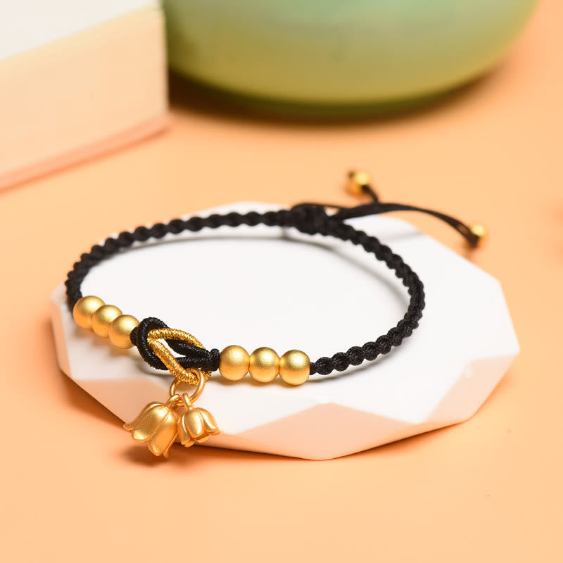 Pulsera trenzada de protección de la suerte con diseño de amuleto de flor de lirio de los valles hecha a mano con Buddha Stones