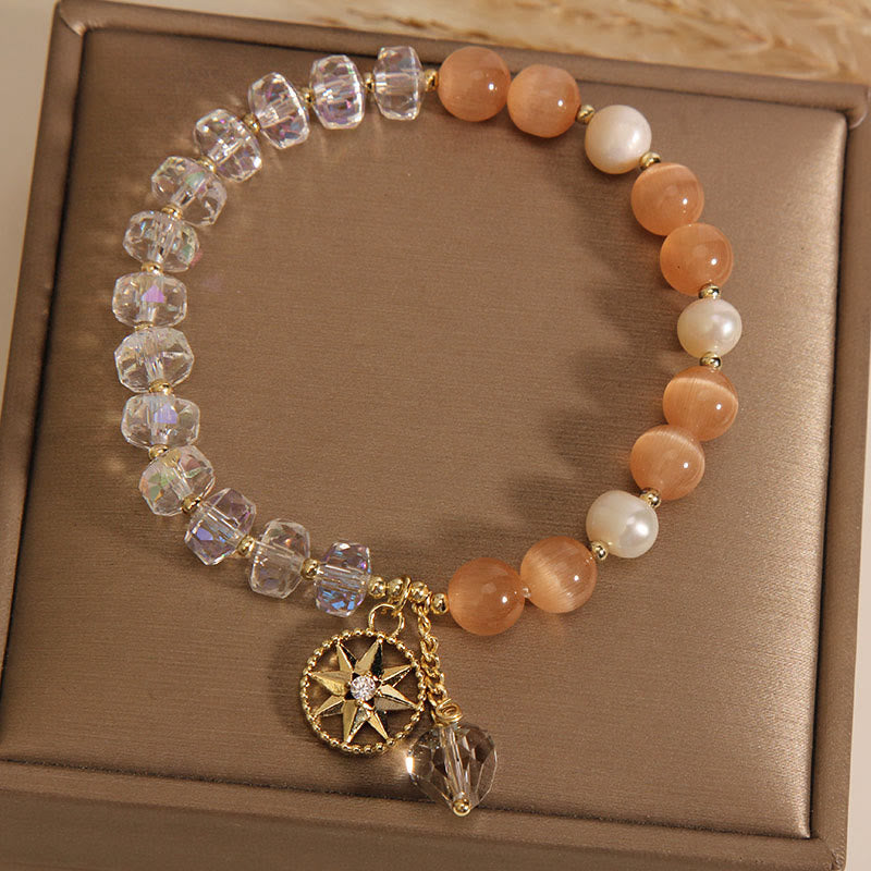 Pulsera de soporte con estrella de cristal blanco y ojo de gato naranja de Buddha Stones