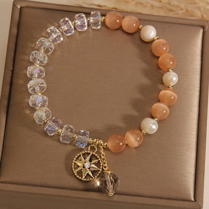 Pulsera de soporte con estrella de cristal blanco y ojo de gato naranja de Buddha Stones