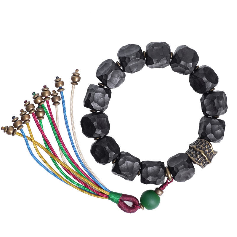 Pulsera Mala de muñeca con borla de paz de cobre y madera de ébano del Tíbet
