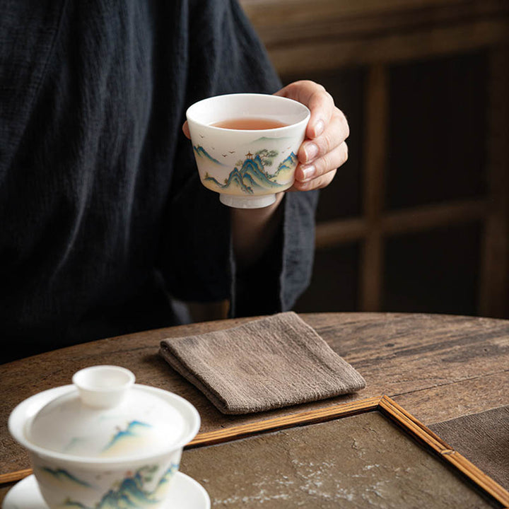 Taza de té de cerámica con Buddha Stones, flor de loto, hoja, montaña, pabellón, alce, peonía, taza de té de Kung Fu