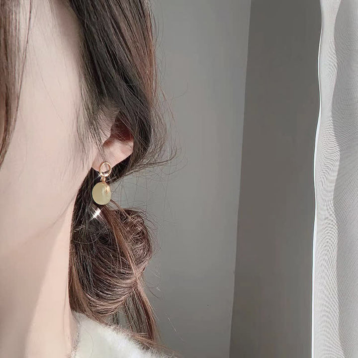 Pendientes colgantes de suerte con hebilla de paz de jade redondo