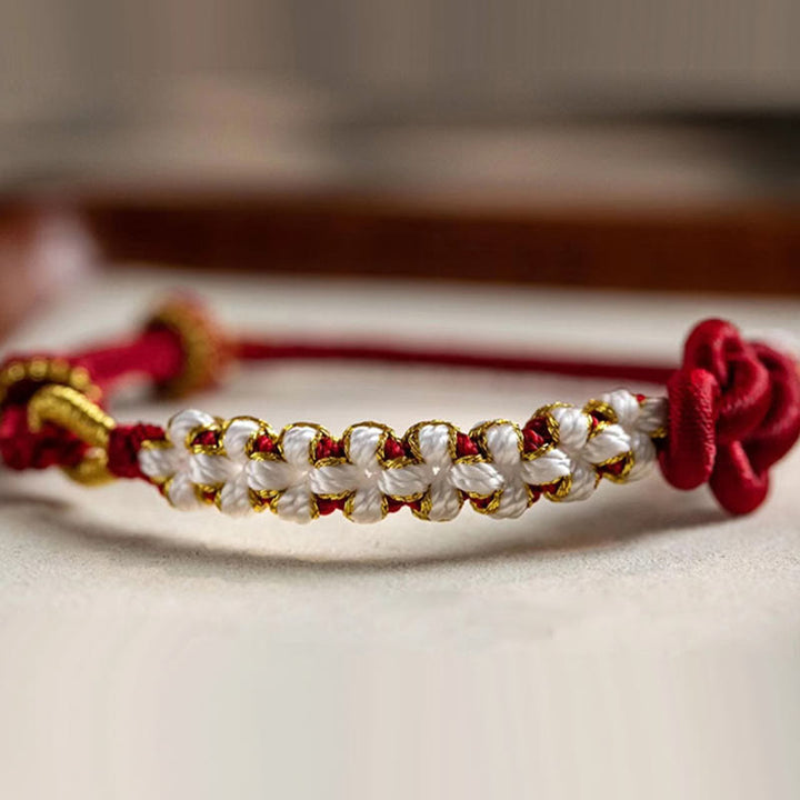 Pulsera de cuerda de la suerte con dije de flor de melocotón, nudo de amor verdadero hecho a mano con Buddha Stones