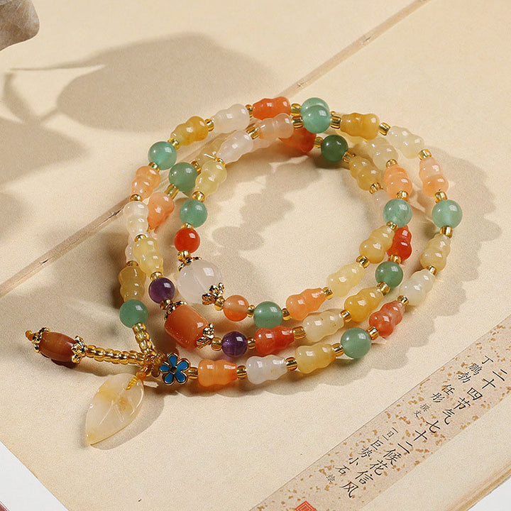 Pulsera de riqueza de calabaza de jade de seda dorada con Buddha Stones