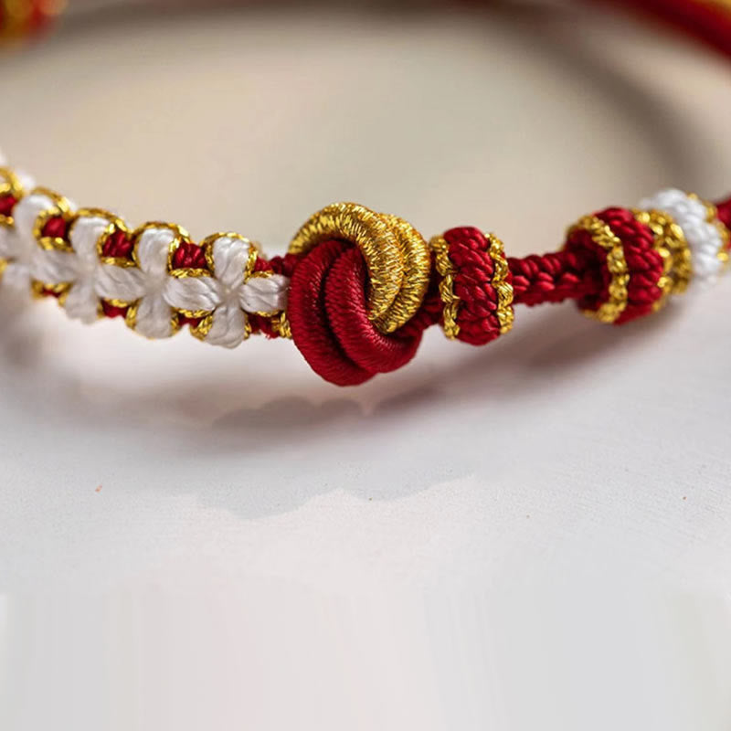 Pulsera de cuerda de la suerte con dije de flor de melocotón, nudo de amor verdadero hecho a mano con Buddha Stones
