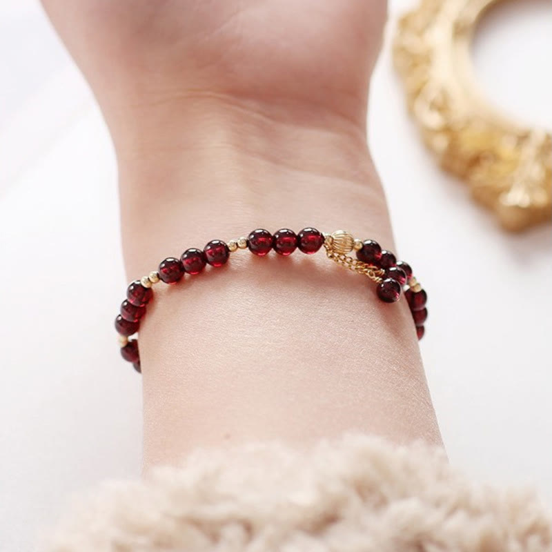 Pulsera Calm de granate natural de oro de 14 quilates con Buddha Stones