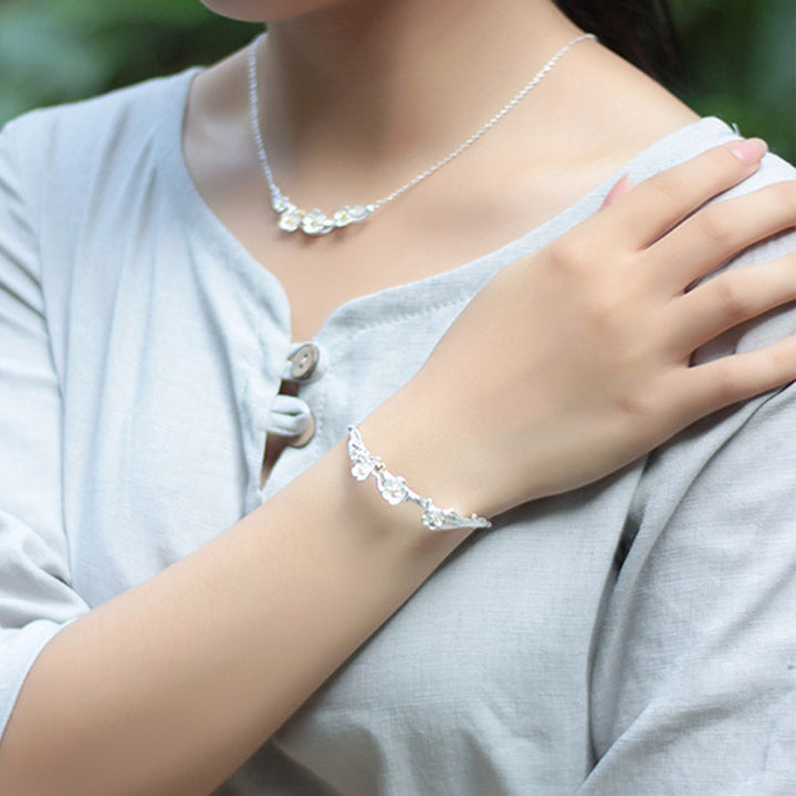 Pulsera ajustable con Buddha Stones de plata de ley 925 con flor de ciruelo y bendición