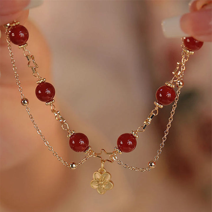 Pulsera tranquila con dije de flor de estrella de ágata roja chapada en oro de 14 Buddha Stones