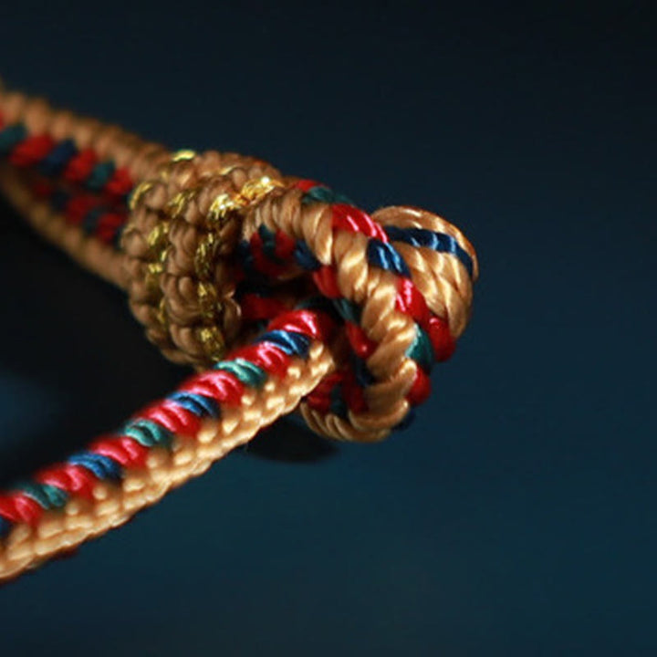 Pulsera de protección trenzada con rueda de oración, nudo de la paz, hecho a mano, con Buddha Stones tibetanas