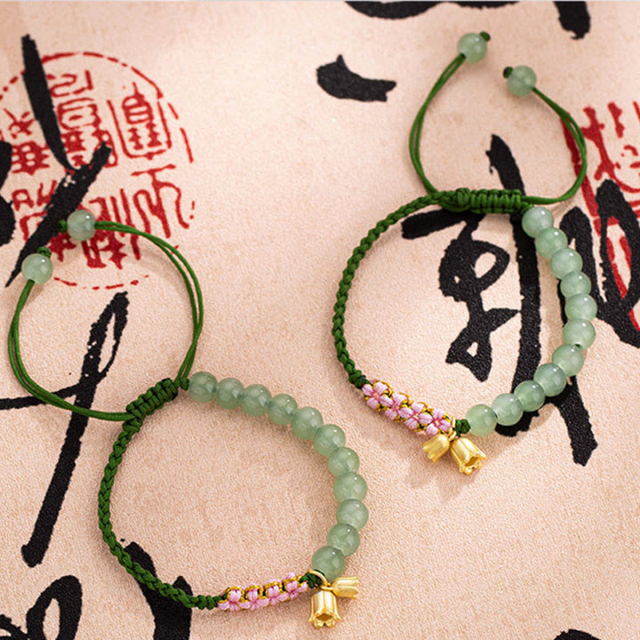Pulsera trenzada de la suerte con dije de lirio de los valles y cuentas de jade hechas a mano con Buddha Stones