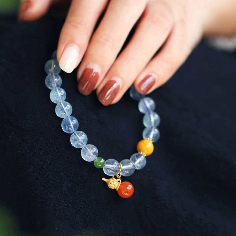 Pulsera con dije de calabaza de la paz con ágata roja y aguamarina